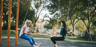 woman sitting on swing
