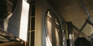 Close-up of an air conditioning unit on a sunny day.