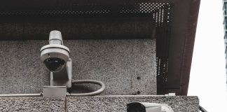 a security camera attached to the side of a building
