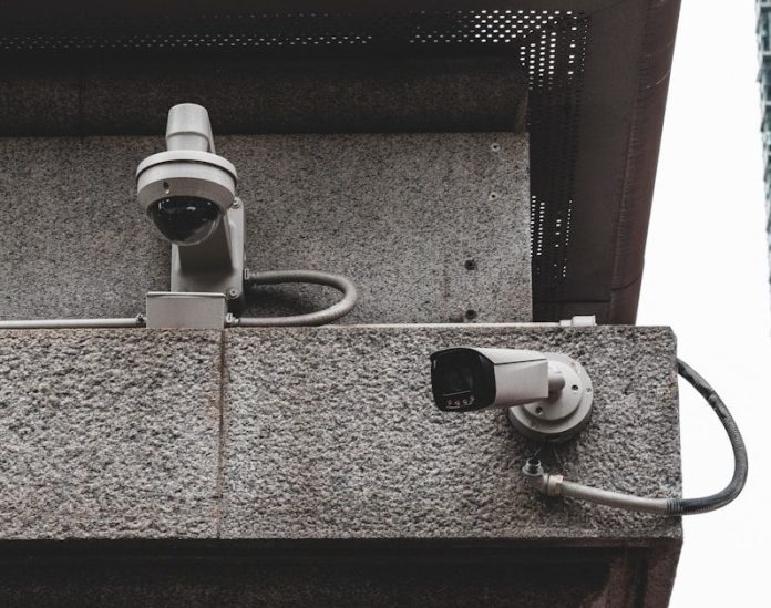 a security camera attached to the side of a building