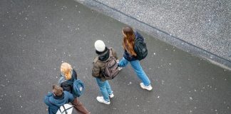 a group of people walking down a street