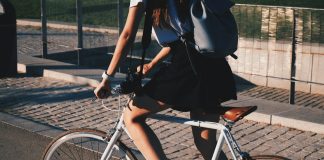woman riding white rigid bike