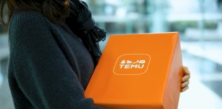 Woman holding an orange temu package